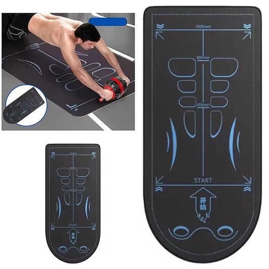 Black exercise mat with muscle diagram and remote control on a white background